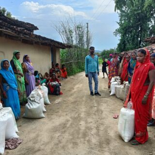 PDS users collecting ration grains in Sohdag Khurd village, Jharkhand. While millets have been subsidised and made available through the PDS, rice remains a staple among beneficiaries. Photo by Mithilesh Singh.